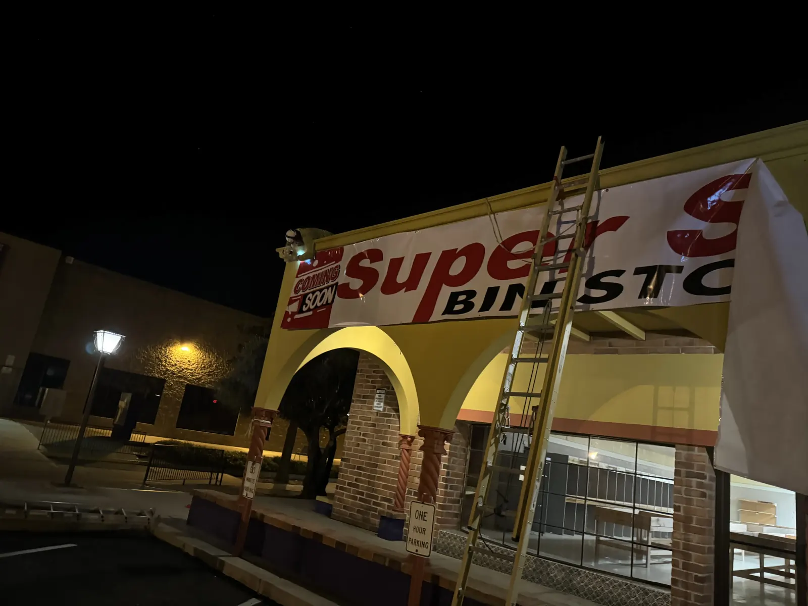 Super Sale Bin Store storefront banner, night