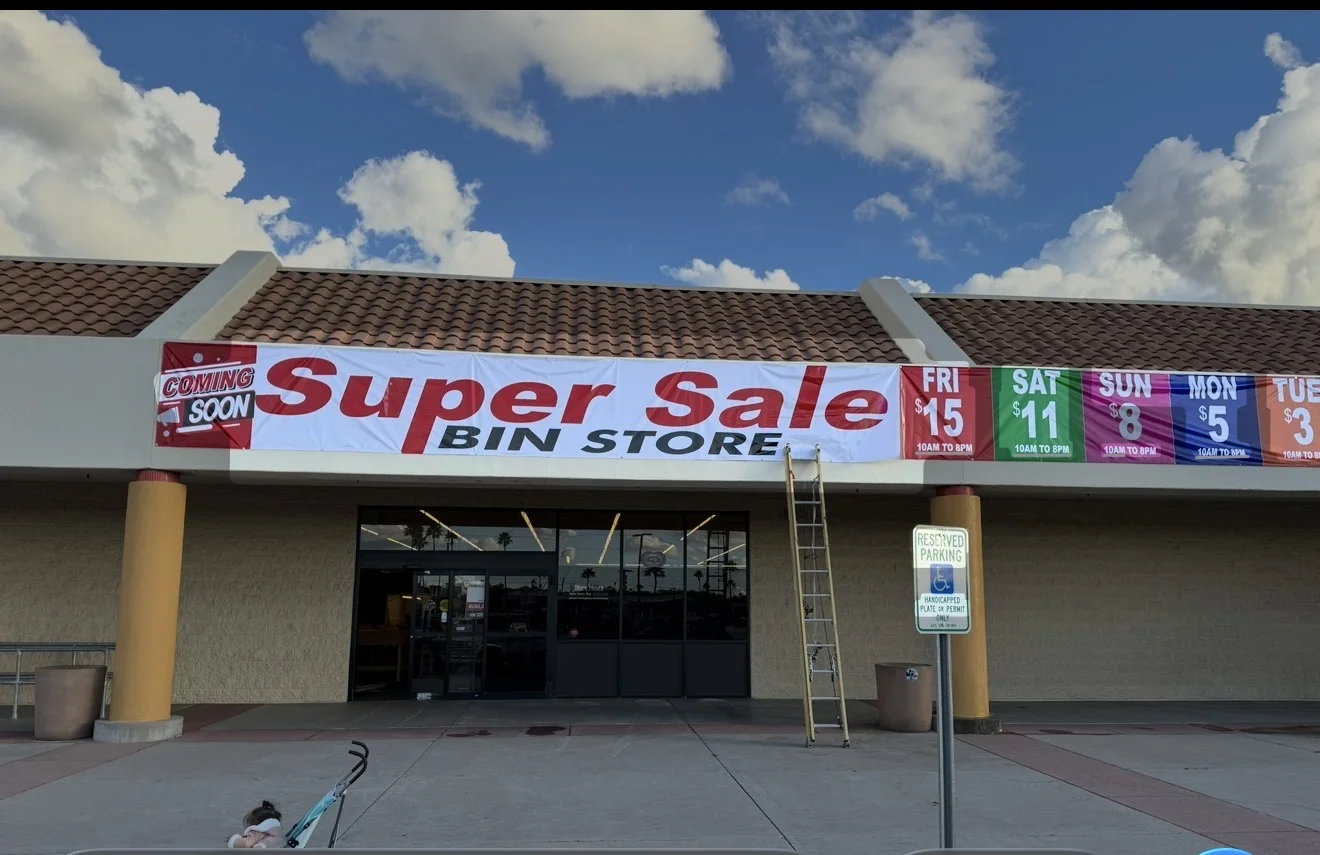Super Sale Bin Store storefront banner, daytime