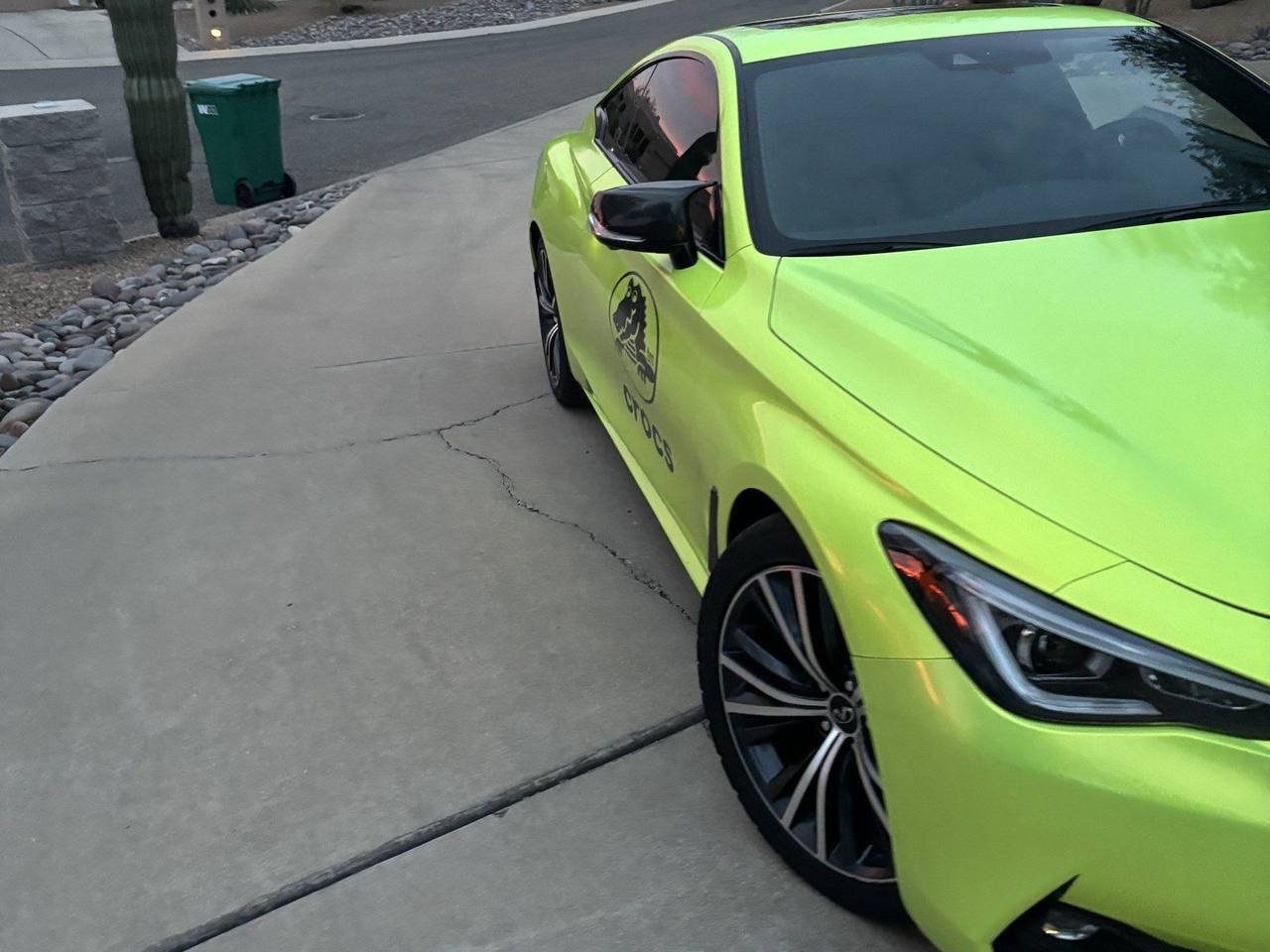 Infiniti Q60 wrapped in gloss yellow-green vinyl by WrappStarr in Tucson