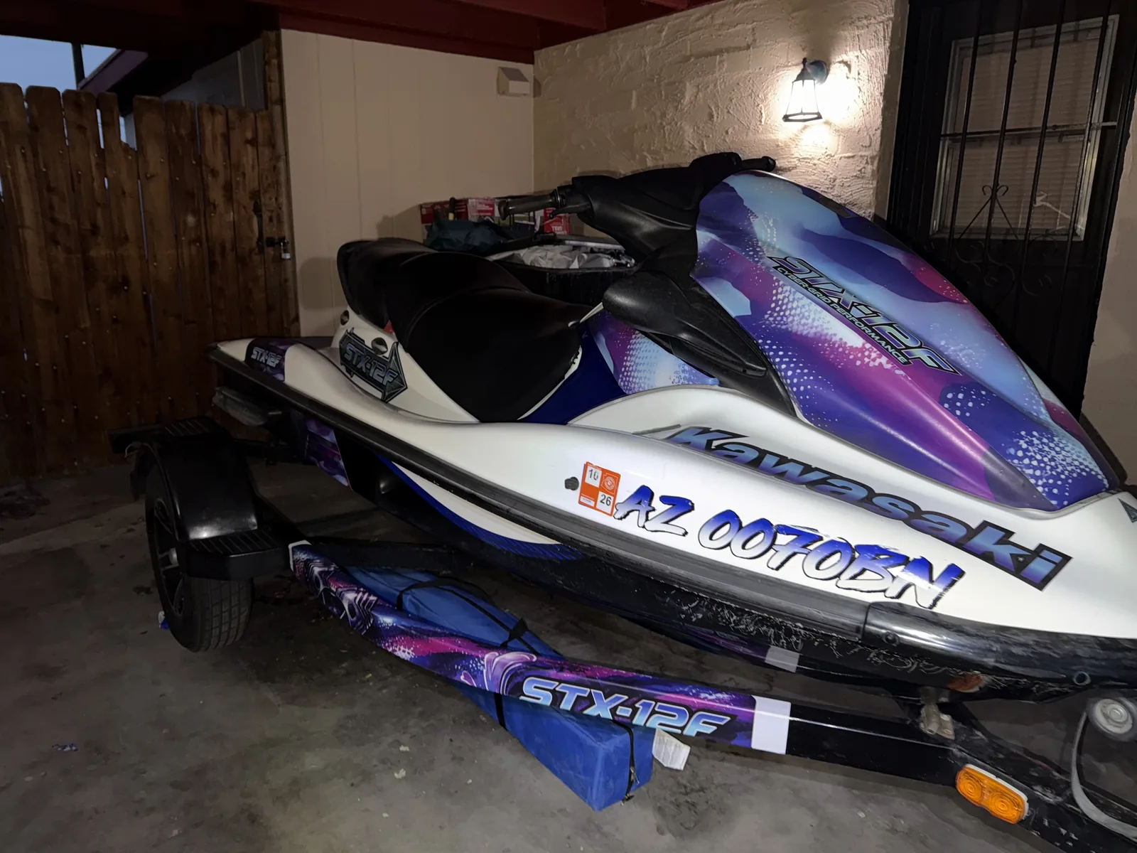 Kawasaki STX-12F jet ski with custom purple and white wrap